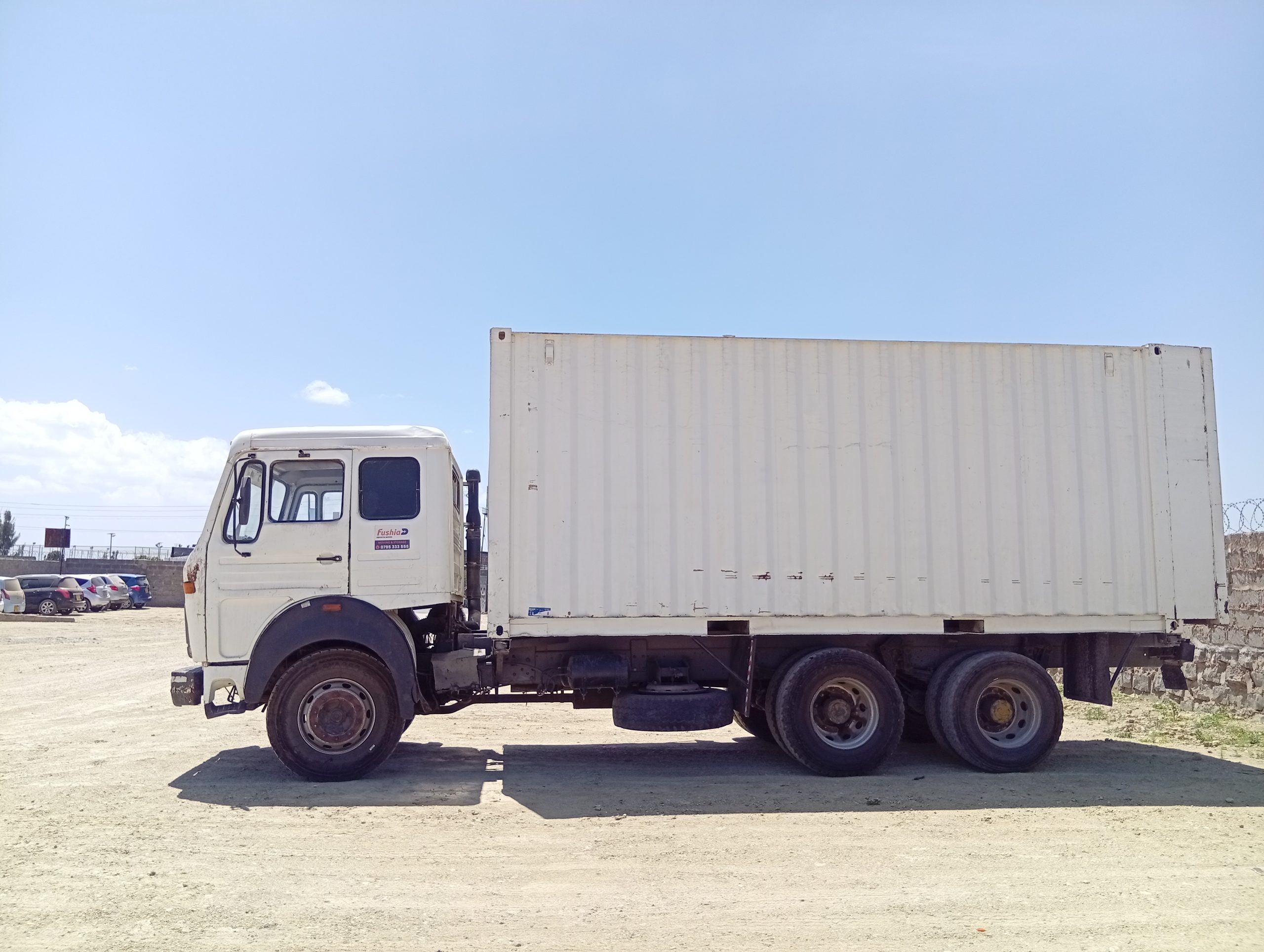 Fushia Logistics truck used for transport and relocation services in Kenya.